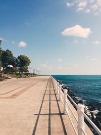 Scenic view of calm sea against cloudy sky