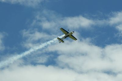 Low angle view of airplane in sky