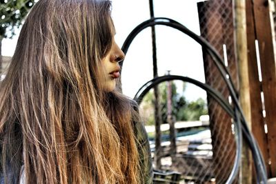 Close-up of young woman sitting outdoors