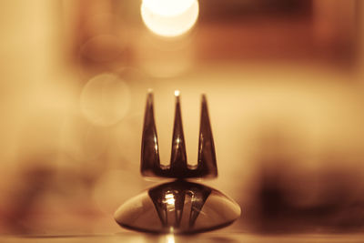 Close-up of lamp on table