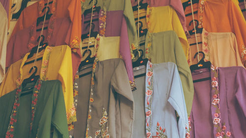 Close-up of multi colored umbrellas hanging in store