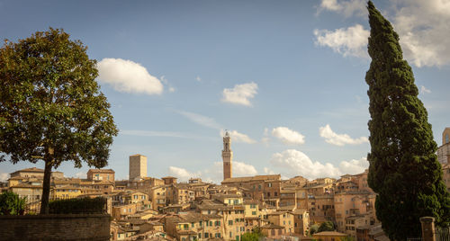 Buildings in city against sky
