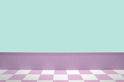 Low angle view of multi colored wall against white background