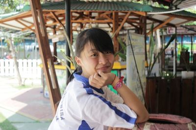 Portrait of woman sitting at outdoor cafe