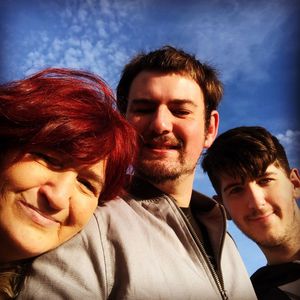 Portrait of smiling family against sky