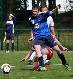 People playing soccer ball
