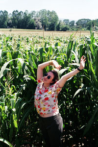 The girl posing on a corn field