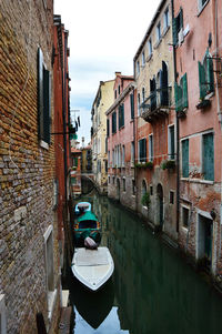 Boats moored in canal