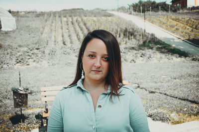 Portrait of woman standing outdoors