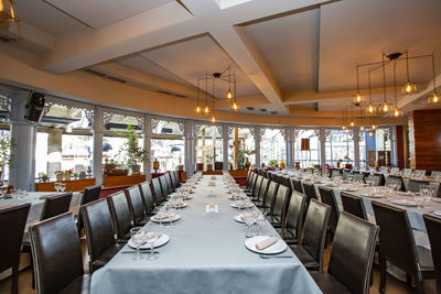 Empty chairs and tables in restaurant