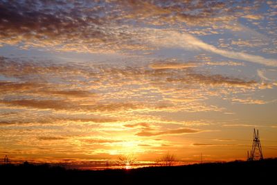 Scenic view of silhouette landscape against sky during sunset