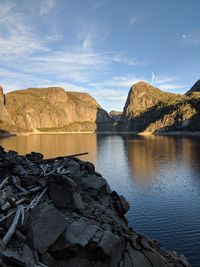 Scenic view of lake and mountains against sky