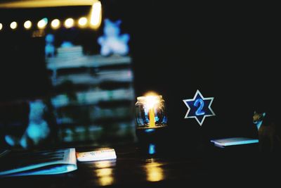 Illuminated christmas lights on table