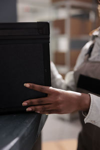 Midsection of man using laptop