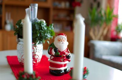 Close-up of santa claus figurine on table