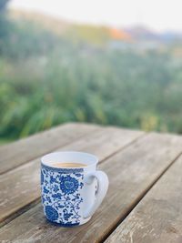 Close-up of coffee cup on table