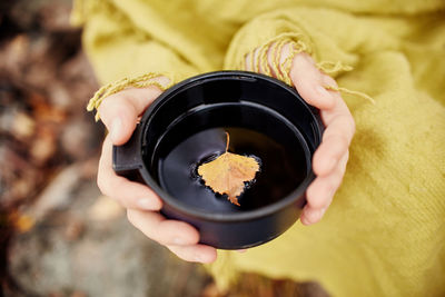 Close-up of hand holding ice cream