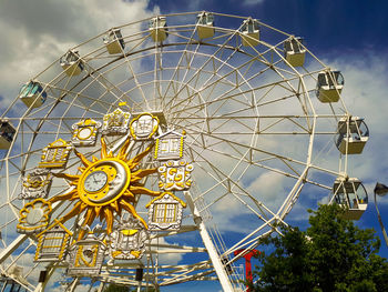 Low angle view of ferris wheel against sky