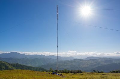 Scenic view of mountains against blue sky