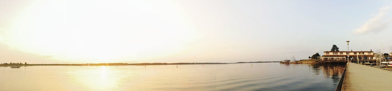 sky, water, architecture, built structure, building exterior, nature, waterfront, reflection, scenics - nature, beauty in nature, copy space, building, no people, cloud - sky, panoramic, tranquility, sunset, travel destinations, river, outdoors