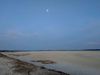 Scenic view of sea against sky at night