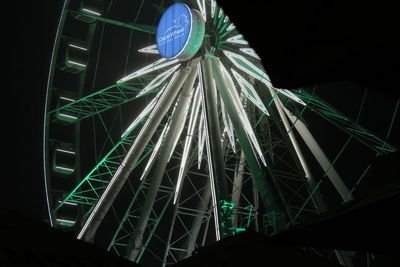 Low angle view of illuminated built structure at night