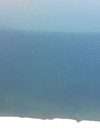 High angle view of sea against blue sky