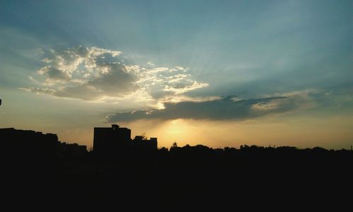 Silhouette of buildings at sunset