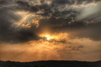 Scenic view of dramatic sky during sunset