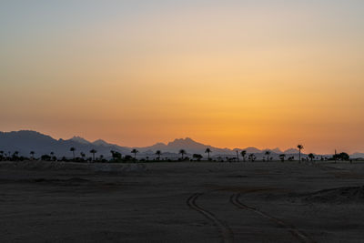 Scenic view of silhouette landscape against sky during sunset