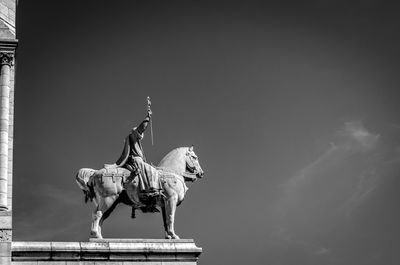 Low angle view of statue against sky