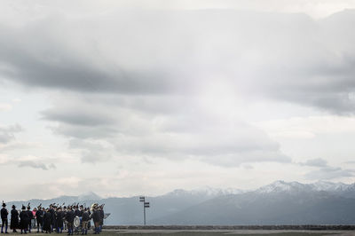 Scenic view of mountains against cloudy sky