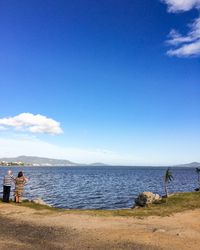 Scenic view of sea against blue sky