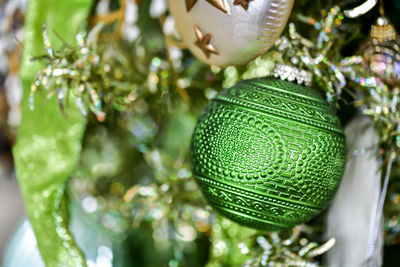 Christmas ornaments hanging from the tree