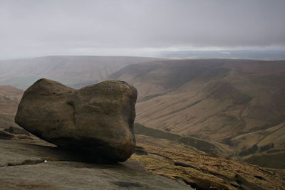 Scenic view of mountain against cloudy sky
