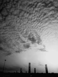 Low angle view of storm clouds over city