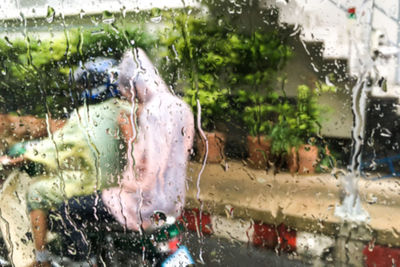 Wet glass window in rainy season