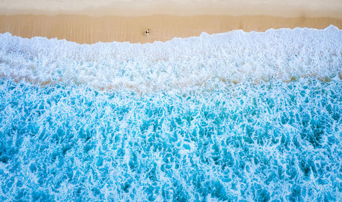 Aerial top view the emerald sea and small tourist at surin beach, phuket, thailand, 