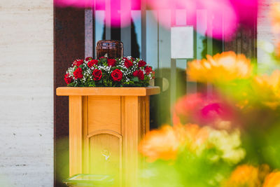 Close-up of flower pot against plants