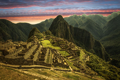 Scenic view of mountains against cloudy sky