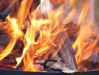 Close-up of burning firewood in pit