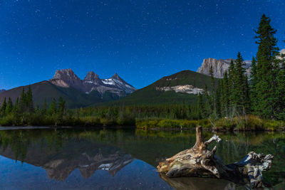 Three sisters trio peaks mountain at night. banff national park, canadian rockies