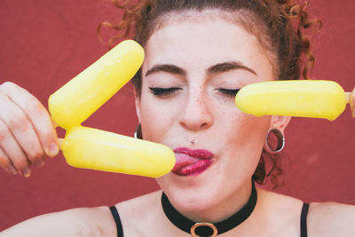 Close-up of young woman holding ice cream