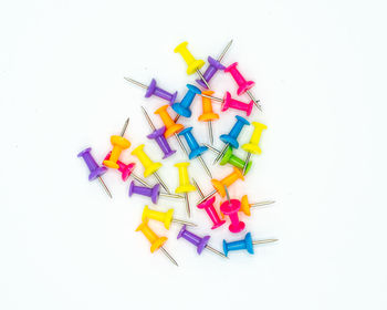 High angle view of multi colored pencils on white background