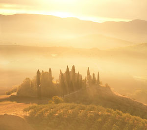 Scenic view of landscape against sky during sunset