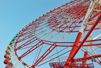 Low angle view of ferris wheel against clear sky