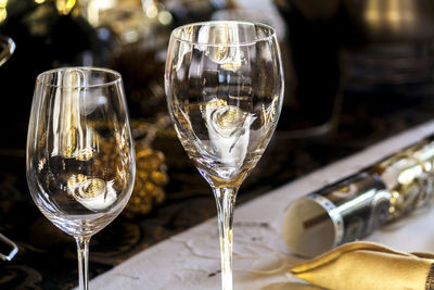 Close-up of wine glasses on table