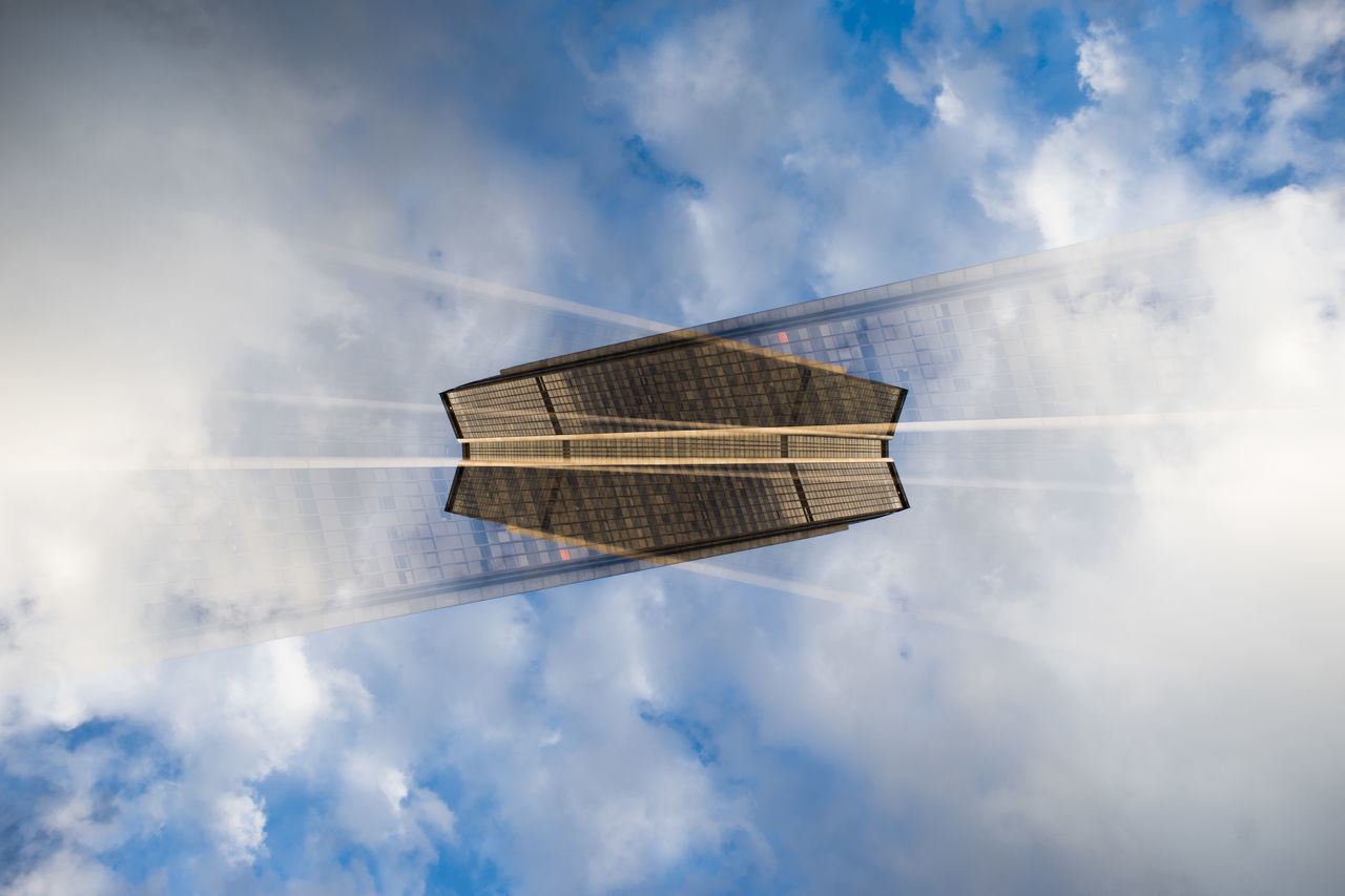 sky, low angle view, cloud, cloud - sky, tower, tall, day, skyscraper, outdoors, tall - high, no people, tranquility, skyline