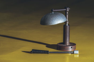 Close-up of electric lamp on table