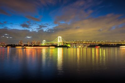 Illuminated city at waterfront